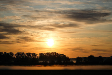 Fototapeta premium sunset or sunrise over the field