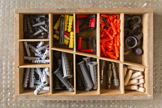 Different wall plugs (dowel) in a box
