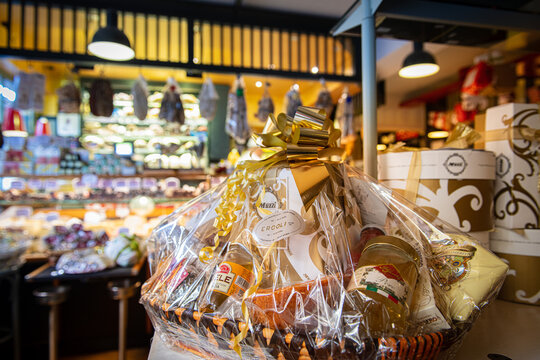 Big Christmas basket full of luxury food and drink delicatessen for sale in grocery store
