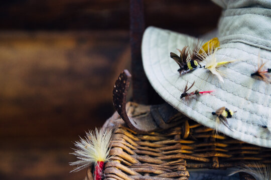 Sun Hat with Fishing Bait on a Tackle Basket