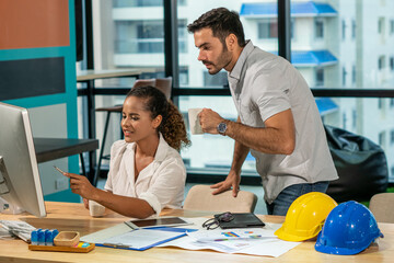 Obraz premium Happy two business people partnership man and woman teamwork discussion about business plan with using computer in office. Confidence office worker or engineer colleague brainstorming work project.