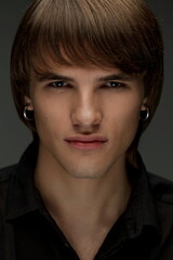 Studio portrait of handsome young man. Clean shaven man