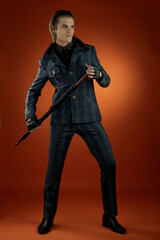 Wearing a black striped jacket, pants, leather shoes, a young businessman. Businessman Walking