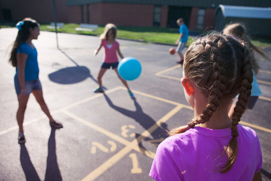 Recess: Girls Play Four Square On Playground