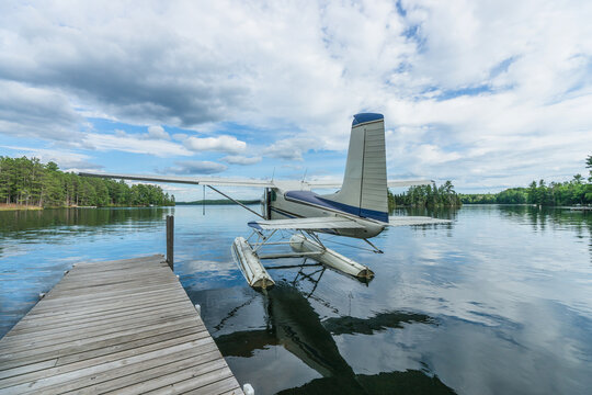 Sea Plane Travels Away From the Dock for Takeoff