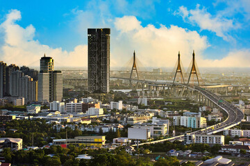 High angle view of the Industrial Ring Road and Bhumibol Bridge, Cityscape in the afternoon of Bangkok. Beautiful blue sky day