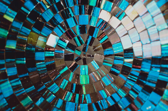 Blue shiny stones/gems in a circular pattern