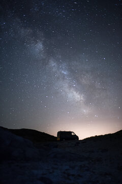 A van under the Milky way view during a crear night