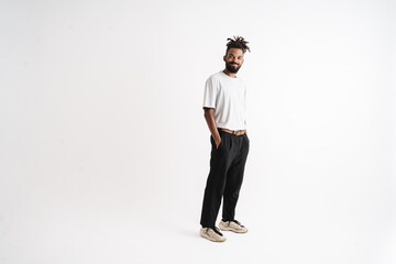 Photo of joyful african american guy smiling and looking at camera