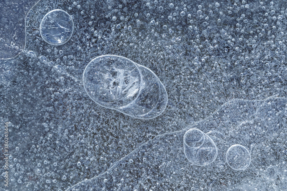 Poster macro close-up of ice on a frozen lake in the winter, viewed from above. abstract full frame texture