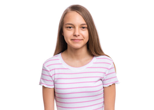 Beautiful teen girl smiling and looking at camera. Portrait of young pretty funny child, isolated on white background. Young happy teenager in studio.