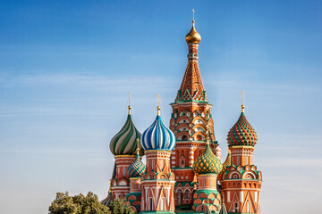 Fototapeta na wymiar St. Basil's Cathedral on Red Square in Moscow against the background of a bright blue sky on a sunny day.