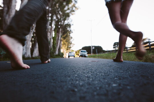 two friends race down the road