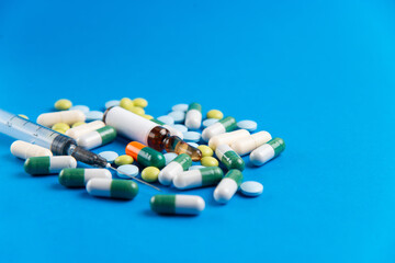 Coronavirus 2019-nCoV outbreak. Pills and drug, care during illness. Blue background.