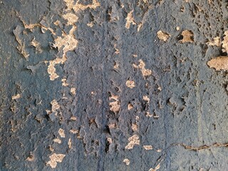 blue painted background texture of old chipped plaster on the concrete wall