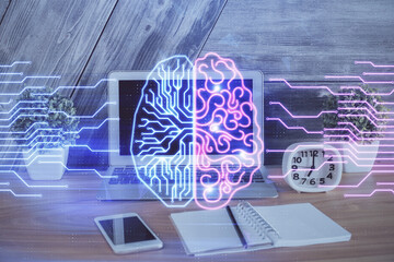 Multi exposure of work table with computer and brain hologram. Brainstorm concept.