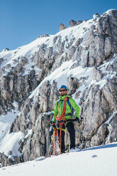 portrait of fully equipped mountaineer on a glacier