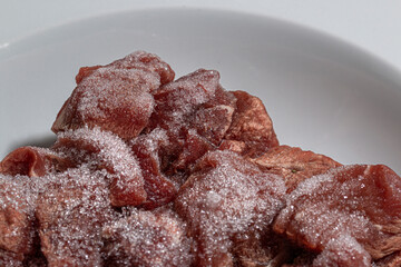 a piece of meat that has been spoiled by incorrect storage