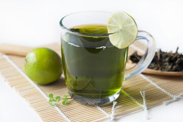 green tea and lime on the table, brew tea