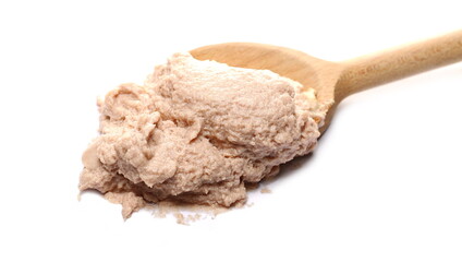 Ham pate, meat spread with wooden spoon isolated on white background