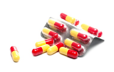 Pills in strip, medical capsules isolated on white background