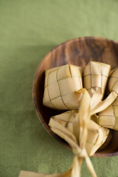 Ketupat or rice dumpling packed inside woven palm leaf pouch
