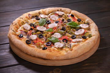 delicious pizza with tomatoes, mushrooms and herbs