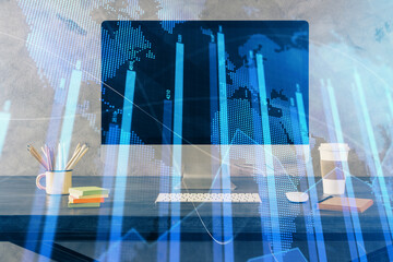 Financial graph colorful drawing and table with computer on background. Multi exposure. Concept of international markets.