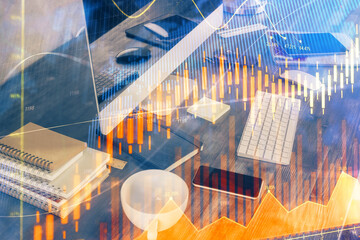 Multi exposure of chart and financial info and work space with computer background. Concept of...