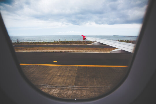 Airplane Wing During Takeoff From Denpasar Airport (DPS) in Bali, Indonesia