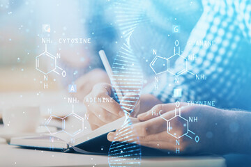 Man's hands working with notes background. Genetic engineering and gene manipulation concept.