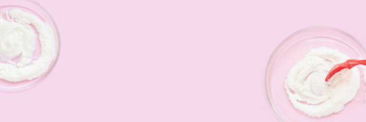 Collagen white powder. Pastel color background. Health product. Woman cosmetics concept. Sport supplement. Skincare cosmetics. Horizontal banner. Pink monochrome. Spoon