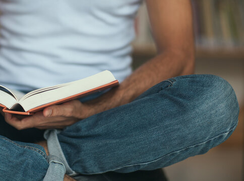Close Up of a Man Holding a Book