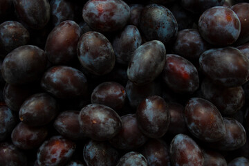 Heap of ripe plums close up