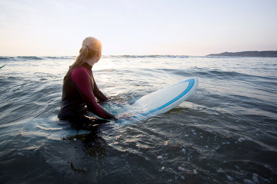 Surf couple at beach.
