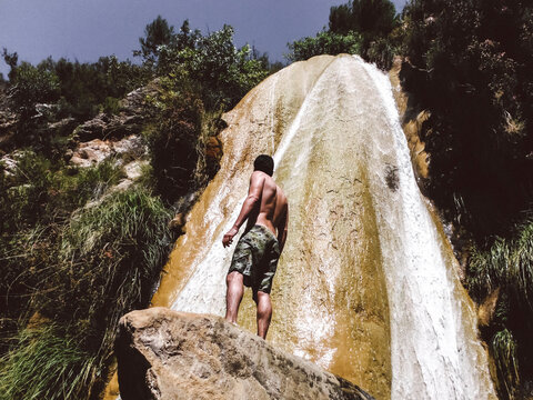 Man on the source of the river