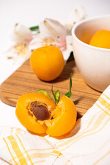 Composition of fresh apricots for culinary dessert class or wallpaper. Summer fruit harvest. Healthy vegan eating. Raw recipe. High quality photo