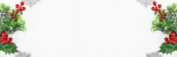 Christmas background. Branch of a Christmas tree and snowflakes in the snow. Christmas and New Year concept. Banner. Copy space