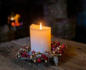 Christmas candle decoration in a cosy rustic English village pub.