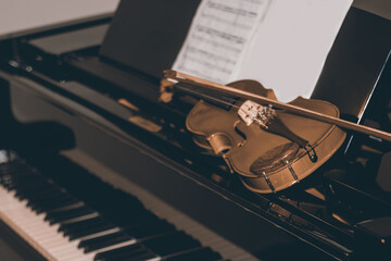 Selectoive focus shot of violin on the piano