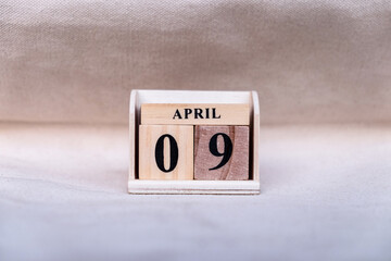April 9th. Image of April 9 Pastel color calendar on white canvas background. empty space for text