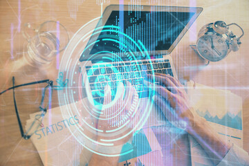 Businessman with computer background with technology theme hologram. Concept of big data. Double exposure.