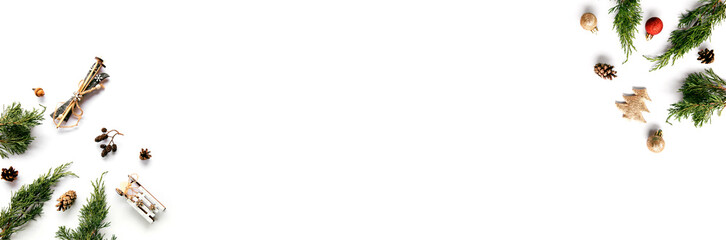 Creative winter composition with pine cones, fir tree and balls on white background.