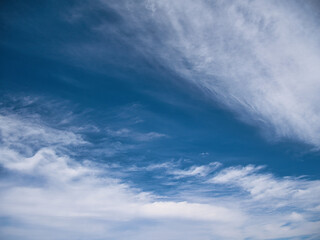 Blue sky with high white clouds.