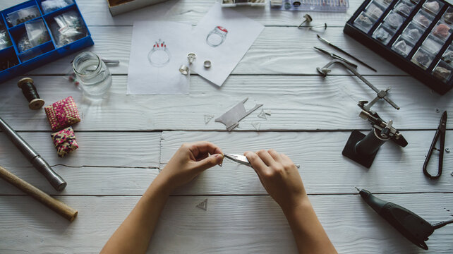 Jeweler Working With Tools At The Workshop