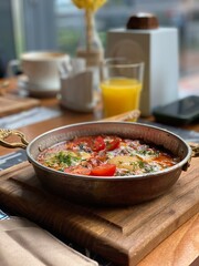 Vegan meal with tomato, eggs and avocado