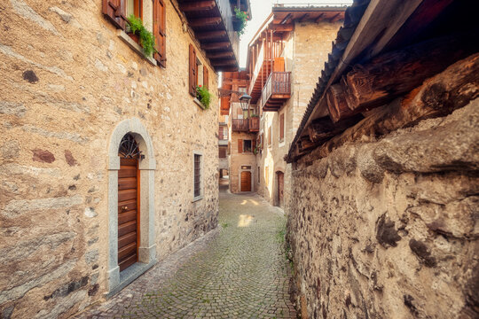 Detail of the old houses facades and alleys in Bagolino, a small town in the Lombardy Region (province of Brescia), famous for its Bagoss cheese made with goat's milk. Color image.