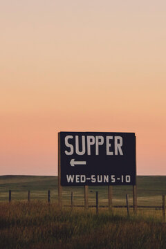 Turn Here For Supper - Road Sign