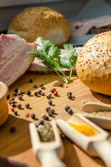 Still life with pieces of bacon on the wooden background