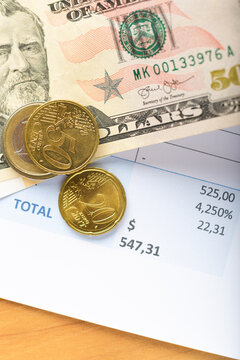 Invoice bill, dollar and euro money banknotes coints on table, accounting concept